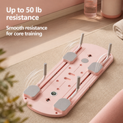 A pink and gray core training resistance board shown on a beige yoga mat in a home setting, with text overlays reading 'Up to 50 lb resistance' and 'Smooth resistance for core training'.