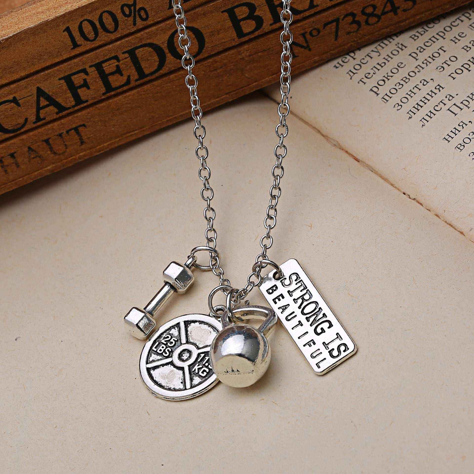 Titanium Steel Dumbbell & Barbell Pendant Necklace – Stylish Gym Jewelry for Fitness Lovers.